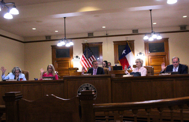 The Williamson County Commissioners Court approved the tax abatement agreement for Labatt Food Services to set up shop in Jarrell. From left: Commissioners Terry Cook, Cynthia Long, County Judge Steve Snell, Commissioner Valerie Covey and Russ Boles. Photo by Nalani Nuylan. 