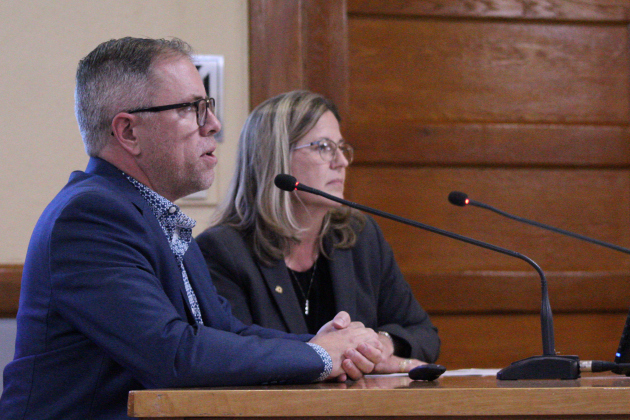 Chief Information Officer Richard Semple, front, and County Auditor Julie Kiley (back), explain the next steps for the new software system for the county during the October 21 meeting. Photo by Nalani Nuylan.