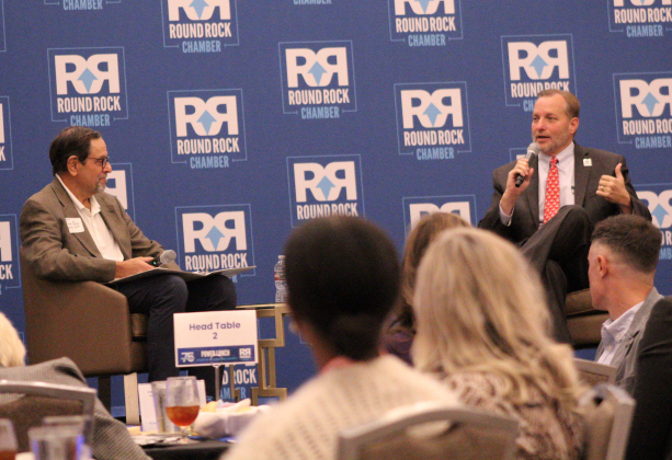 Dave Porter, Director of the Wilco Economic Development Partnership, left, chats with County Judge Steve Snell about the future of Williamson County during the Round Rock Chamber of Commerce Power Lunch, October 22. Photo by Nalani Nuylan.