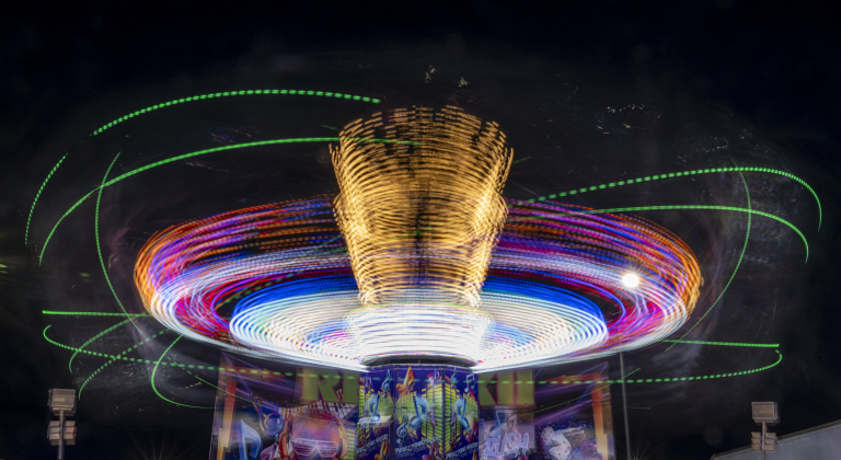 A carnival ride fills the evening skies with color  at the Williamson County Fair on Wednesday, October 22, 2025. Held at the Williamson County Expo Center, the fair and rodeo continues through Saturday.   Photo by Andy Sharp.