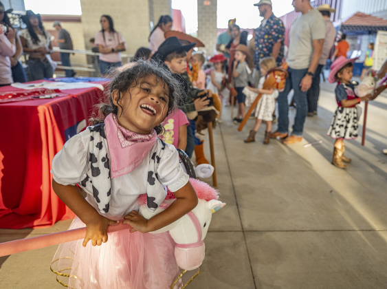 Marina Baltodano, celebrating her 4th birthday today, gets ready to ride her stick horse in the stick horse competition for kids at the Williamson County Fair on Wednesday, October 22, 2025. Held at the Williamson County Expo Center, the fair and rodeo continues through Saturday.   Photo by Andy Sharp.