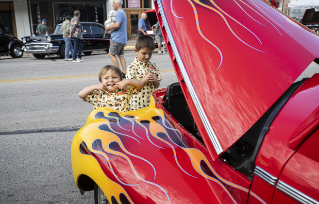 3-year-old Hunter Davila and his brother Kayson, 7, enjoying looking at a 1941 Chevy Deluxe during the 12th Annual Main Street Car Show held in downtown Taylor on Saturday, October 25, 2025.   Photo by Andy Sharp. 
