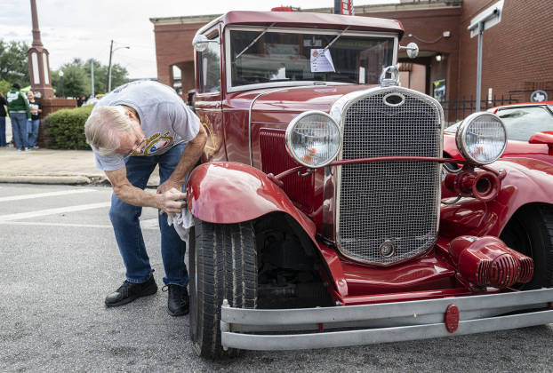 Larry Francis of Kemah, Texas polishes his 1931 Ford Firetruck during the 12th Annual Main Street Car Show held in downtown Taylor on Saturday, October 25, 2025.   Photo by Andy Sharp.
