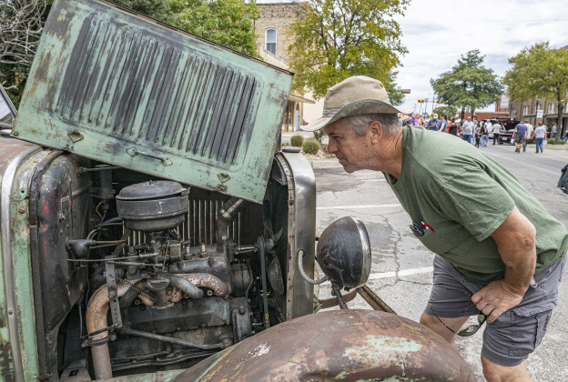 Greg Swantek admires a truck owned by Ian Campbell  during the 12th  Annual Main Street Car Show held in downtown Taylor on Saturday, October 25, 2025.  The truck was built in 1950 in Bakersfield, California,  using parts used  from 1928, 1930 and 1931 Ford trucks.    Photo by Andy Sharp.
