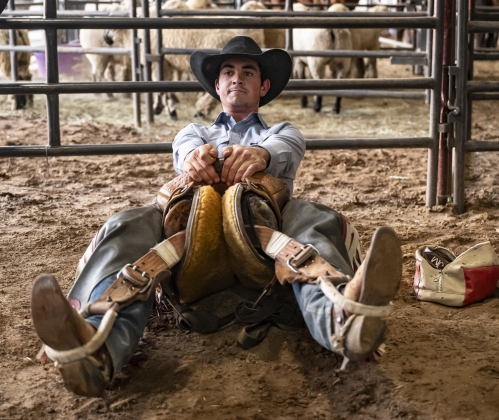 Joe Macqueen of Clarendon, Texas limbers up before competing in Saddle Bronc Riding during the Williamson County Rodeo  on Thursday, October 23, 2025.  The three-night rodeo is held along with the Williamson County Fair at the Williamson County Expo Center.   Photo by Andy Sharp.