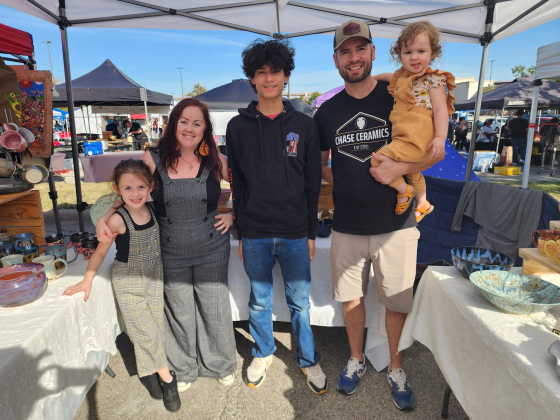 The Chase family works a Chase Ceramics market stand. From left are Adelyn Chase, Ashley Chase, Nephew Tristan Chase, Mark Chase and Elliana Chase.
