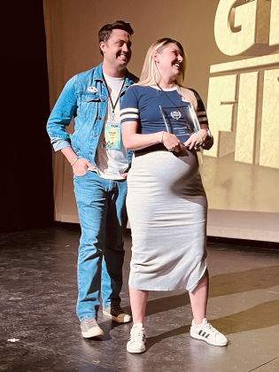 I VOTED Director Tyler Mann and wife/co-producer Rachel DeRouen accept an award at the GTX Film Festival.