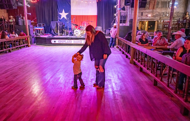Brittany Donathan dances with her daughter Harper, 22-months-old, at the  Coupland Dance Hall on Saturday, August 30, 2025.        Photo by Andy Sharp.