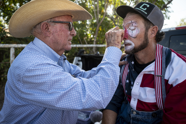 Larry Clayman,  left, helps apply clown makeup on his son, Matthew William Clayman at the 32nd Annual Clayman  Rodeo held at Windsong Farm on Saturday, October 4, 2025.  Larry Clayman, 85, a longtime rodeo clown and bullfighter is being inducted into the National Rodeo Hall of Fame on November 7-8.  