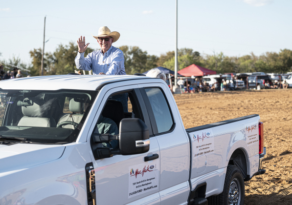 Larry Clayman acknowledges the crowd as he is driven through the arena  at the 32nd Annual Clayman  Rodeo held at Windsong Farm on Saturday, October 4, 2025.