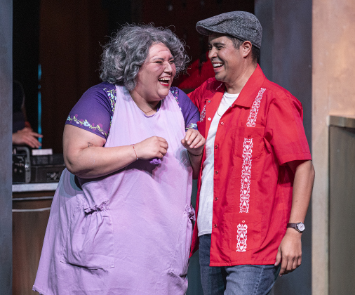 Gina Marie, as Abuela Claudia, and Daniel Ponce, playing Usnavi, are pictured in a scene from the Thursday, October 2, 2025 dress rehearsal for “In the Heights,” playing on the Palace Springer Stage through November 2nd.  Photo by Andy Sharp.  