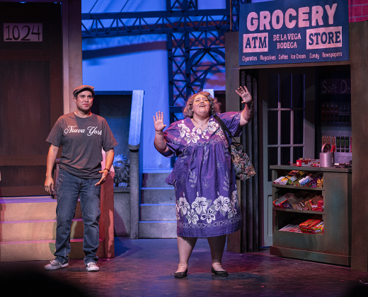 Daniel Ponce, playing Usnavi, and Gina Marie, as Abuela Claudia, are pictured in a scene from the Thursday, October 2, 2025 dress rehearsal for “In the Heights,” playing on the Palace Springer Stage through November 2nd.  Photo by Andy Sharp.