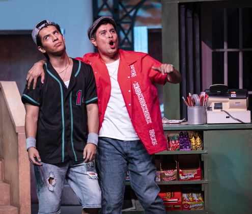 Rafael De La Cruz Colunga, left, as Sonny, and Daniel Ponce, playing Usnavi, are pictured in a scene from the Thursday, October 2, 2025 dress rehearsal for “In the Heights,” playing on the Palace Springer Stage through November 2nd.  Photo by Andy Sharp.