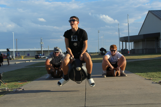 Three Florence ISD students race each other on inflatable bulls during National Night Out. Other activities included bounce houses and hay rides.