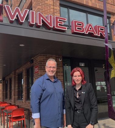 General Manager Dale Peake, left, and head sommelier Kaitlyn Pearson stand outside of Körk Wine Bar located on the Square near the Grace Heritage Center. (Photo by Kaitlyn Wilkes)
