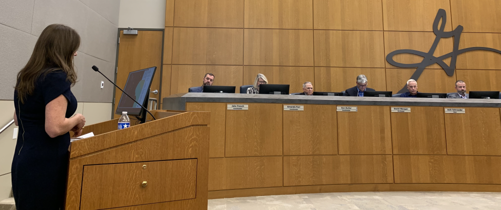 Kelly Trietsch, chief development officer, left, presents the Southwestern University 560 zoning change to Georgetown City Council. (Photo by Kaitlyn Wilkes)