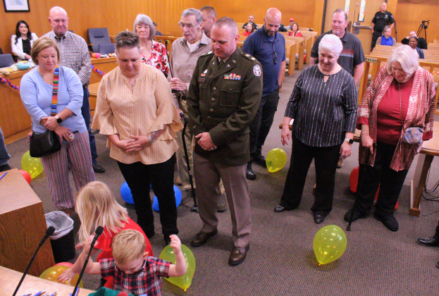 Family and friends watch Jonah and his older sister Riley, 4, play with balloons in the courtroom during the adoption hearing. Photo by Nalani Nuylan.