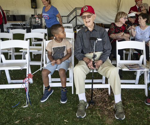 5-year-old Micah Wheeler visits with Marine Corps veteran Bill Harrah, 95, during an event honoring the 250th birthday of the United States Marine Corps  at the Georgetown Field of Honor in San Gabriel Park  on Saturday, November 8, 2025.