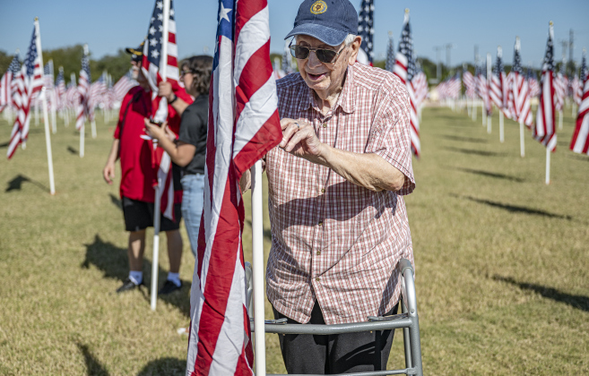 Air Force veteran Bob Reed, 94, placed American flags at the Georgetown Field of Honor in San Gabriel Park  on Saturday, November 8, 2025.