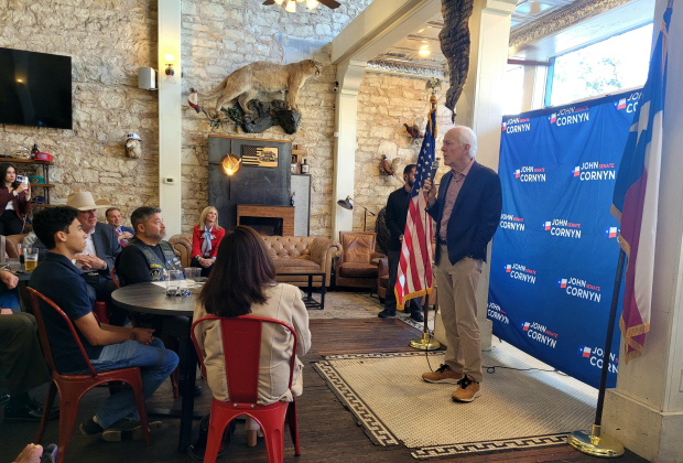 U.S. Senator John Cornyn, right, hosts a camping rally event at Mesquite Creek Outfitters on the Georgetown Square on Tuesday afternoon. Photo by Nalani Nuylan.