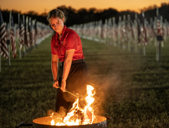 17-year-old Christianna White oversees a flag retirement ceremony at the Field of Honor on Friday, November 14, 2025.  White, along with her mother, Denise White, has taken  part in Field of Honor activities for all of its nine years in Georgetown.  Taking part in the ceremony were members of Scouting America Troop 1096, representatives from the Civil Air Patrol, veterans and active duty military, plus members of the public.  Photo by Andy Sharp.