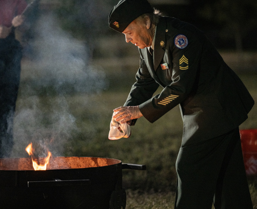 Retired Army First  Sgt. Fay Pool takes part in  a flag retirement ceremony at the Field of Honor on Friday, November 14, 2025. .  Taking part in the ceremony were members of Scouting America Troop 1096, representatives from the Civil Air Patrol, veterans and active duty military, plus members of the public.  Photo by Andy Sharp.