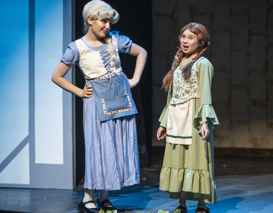 Brynn Schnneekloth, left, as Young Elsa, and Ella Schnneekloth, right, as Young Anna, are pictured in a scene from the Thursday, November 20, 2025 dress rehearsal of “Frozen,” playing through February 1, 2026 on the Springer Stage. Photo by Andy Sharp.