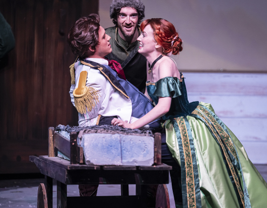 Jake Jordan, left,  as Hans, Jon Bristol, center, as Kristoff, and Lauren MacLeod, playing Anna,  are pictured in a scene from the Thursday, November 20, 2025 dress rehearsal of “Frozen,” playing through February 1, 2026 on the Springer Stage. Photo by Andy Sharp.