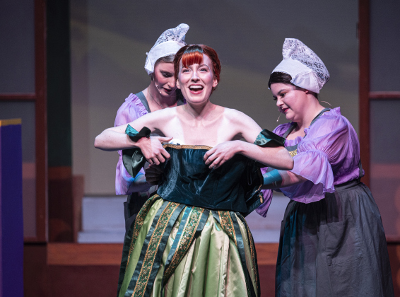 Lauren McLeod, center, as Anna, is assisted by Handmaidens played by Grace Coldicott, left, and Morgan Francis, right, in a scene from the Thursday, November 20, 2025 dress rehearsal of “Frozen,” playing through February 1, 2026 on the Springer Stage. Photo by Andy Sharp.