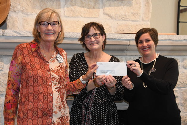  WHO VP Judy Madsen gives a donation to Carver Center Director Nita Riggins and STARRY Program Coordinator JJ Nisula. 