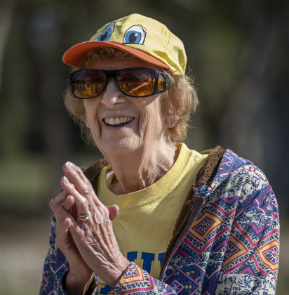 American Association of University Women Member Pat Rehm cheered on the racing rubber ducks during the 10th Annual AAUW Duck Race held on the river at San Gabriel Park on Saturday, November 1, 2025.  Rubber ducks are placed in the river and race to the finish in several heats.  Winners of winning ducks win prizes.   The event raises funds for area high school student scholarships. Photo by Andy Sharp.