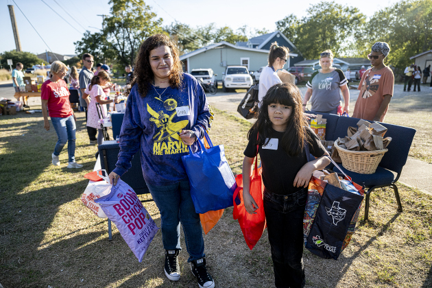 Anna Carrillo, with daughter Lily, 8, right, received food for her family during the Community Food Drive conducted by Antioch Georgetown on on Sunday, November 2, 2025.  The Food Drive was held at St. Paul United Methodist Church.