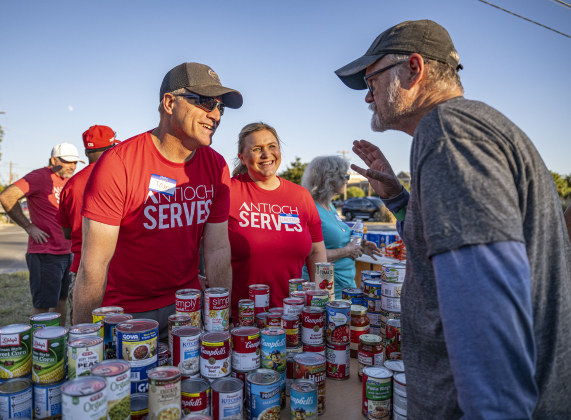 Antioch Georgetown members Tom Pursley and his wife Karrie, center, assist Floyd Bowen, right, during the Community Food Drive conducted by Antioch Georgetown on on Sunday, November 2, 2025.  The Food Drive was held at St. Paul United Methodist Church.   Any donations remaining will go to The Caring Place and Helping Hands of Georgetown.    Photo by Andy Sharp. 