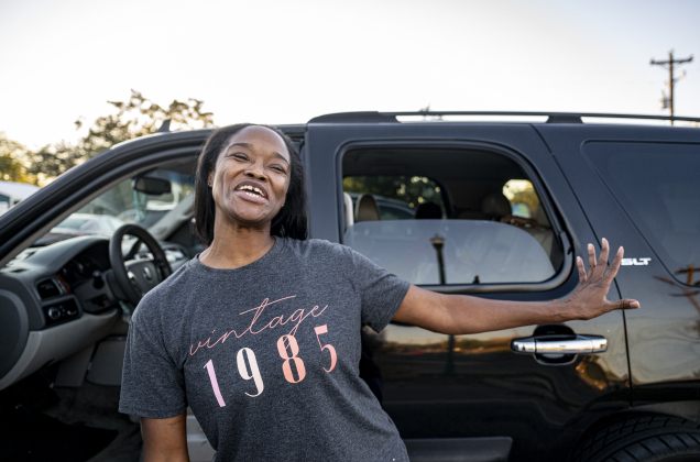 Grace Morton wears a smile after receiving food for her family during the Community Food Drive conducted by Antioch Georgetown on on Sunday, November 2, 2025.