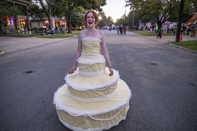 Iris Blanton wore a layer cake costume she made herself as she strolled along Main Street  during Halloween along Main Street on Friday, October 31, 2025.  Photo by Andy Sharp.