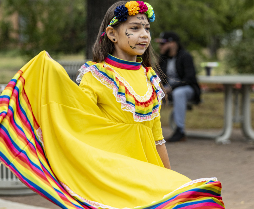 10-year-old Amelia C. (parents asked no last name be published) was well-attired while enjoying the music of Mariachi Espuelas during Georgetown’s Dia de los Muertos,  held Saturday November 1, 2025  in the South Main Arts District along 9th Street.  The event included music and dance performances throughout the day.   Photo by Andy Sharp.