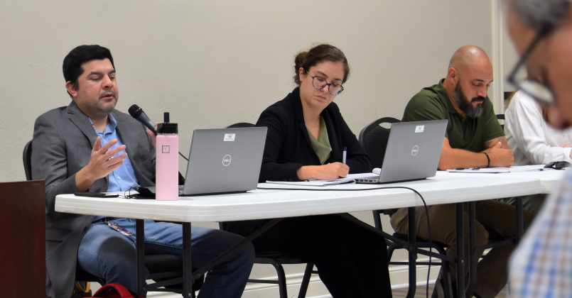 TCEQ employees, from left, Jose Alfonso Martinez, Maricela Zertuche and Alan Barraza were there to answer resident questions and explain the cleaning process for the wastewater. (Photo by Kaitlyn Wilkes)