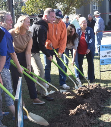 Habitat breaks ground on the Leander Street Cottages at 1839 Hart Street on November 22. From left are Amy Parham, Habitat Texas CEO; future homeowner Ashley Fordinal; Texas State Senator Charles Schwertner; Matthew and Belinda Schwertner, Senator Schwertner’s wife and son; and Shirley Harmes, Habitat volunteer.