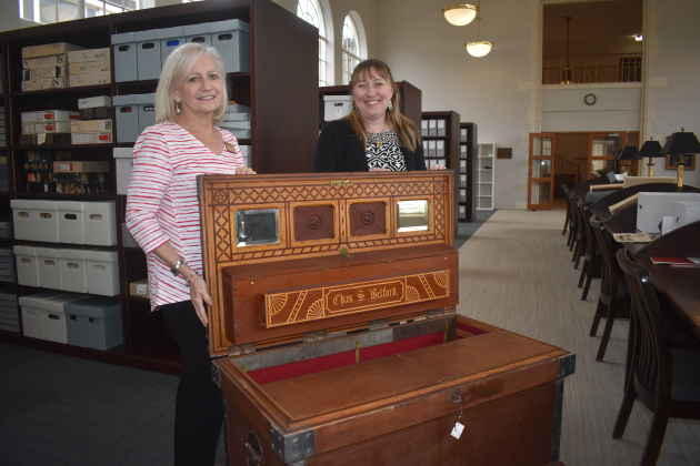 C.S. Belford’s personal toolbox containing his tools is now at Southwestern’s Distinctive Collections &amp; Archives. It’s treasured by, left, Mary Fields, Special Collections and Archives Assistant, and Megan Firestone, right, Head of Distinctive Collections &amp; Archives.