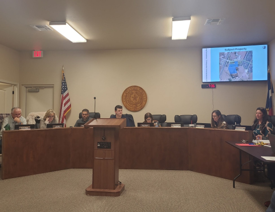 Jarrell City Council reviews the proposed property of the Cornhill Business Park during the December 1 meeting. From left: Daniel Klepac, Mayor Pro Tem/Alderman Place 1, Lori Allen, Alderwoman Place 2, City Manager Jorge Hernandez,  Mayor Patrick Sherek, Tanya Clawson, Alderwoman Place 3, Tammy Fitzner, Alderwoman Place 5, and Development Services Director Yvonne Spell. Photo by Nalani Nuylan.