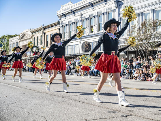 The Sun City Georgettes participate in the parade along Austin Avenue during the annual Christmas Stroll, held in downtown Georgetown on Saturday, December 6, 2025.   Photo by Andy Sharp.