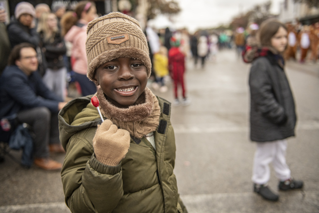 Breck Madson had a good spot to watch the parade on Austin Avenue during the annual Christmas Stroll on Saturday, December 7, 2024. Temperatures remained in the 40s, with occasional rain. (Sun Archive)