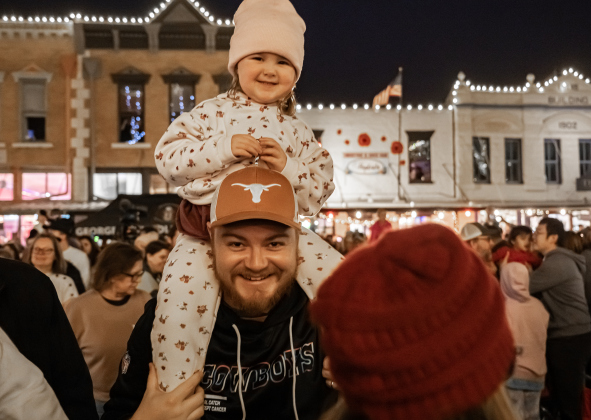 Robert Gowens and his niece Lyla Jones, 3, were among the many attendees along Main Street during the Lighting of the Square on Friday, November 28, 2025.   Photo by Andy Sharp.