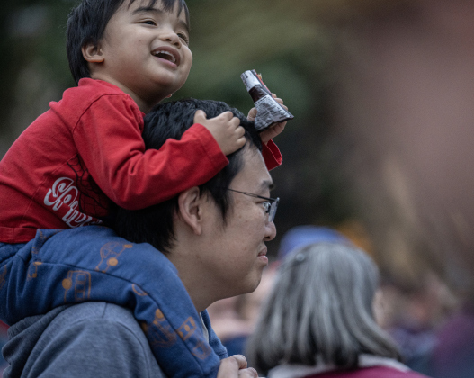 Tim Chang and his son Eli, 2, enjoyed the evening at  the Lighting of the Square on Friday, November 28, 2025.   Photo by Andy Sharp.