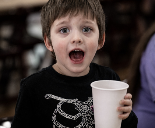 4-year-old Alex Salyer enjoyed a meal with his family during  the Georgetown Community Thanksgiving, held at the San Gabriel Community Center on Thursday, November 27, 2025.