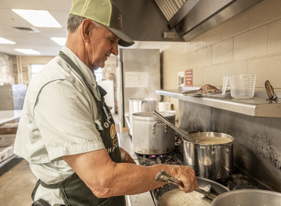 Gary Kovar prepares gravy  at the Georgetown Community Thanksgiving, held at the San Gabriel Community Center on Thursday, November 27, 2025.
