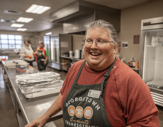Alycia Tandy, one of the founders the Georgetown Community Thanksgiving, helps oversee the kitchen area at the San Gabriel Community Center on Thursday, November 27, 2025.