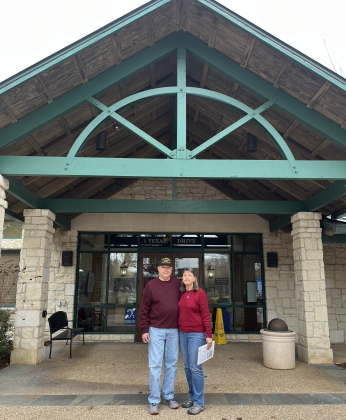 Beverly and John Henry in front of the Sun City Sales Center. 