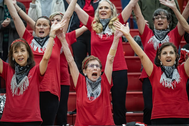 Linda Wall (front center), 83, a member of the Sun City Georgettes, cheers on the action during a matchup pitting the Granny Basketball Team, the Texas Fire Ants, against the Georgetown Police Department,  held at East View High School on Saturday, January 17, 2026.  The Georgettes performed a halftime show.   The game, won by the Fire Ants, with a final score of 55-47,  benefits the Carver Center for Families.      Photo by Andy Sharp.