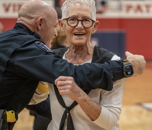Georgetown Police Department Commander Erik Grasse, left, congratulates 81-year-old Judy Hanes  after her team, the Texas Fire Ants, won the matchup with the police department  55-47 during a contest  held at East View High School on Saturday, January 17, 2026.  The game benefits the Carver Center for Families.      Photo by Andy Sharp